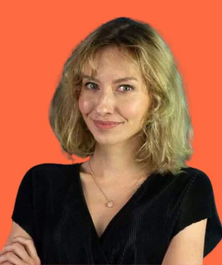 Smiling blonde woman wearing a black top, against an orange background.